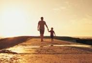 father_son_walking_down_beach
